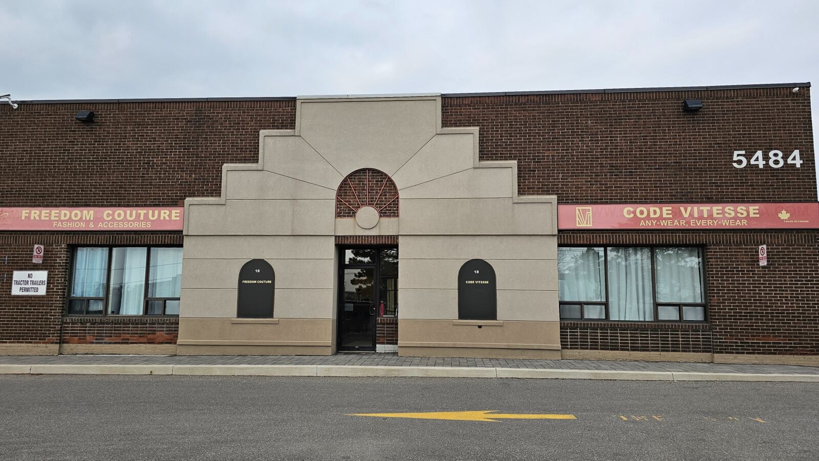 Front exterior of the brick and precast commercial building at 5484 Tomken Road